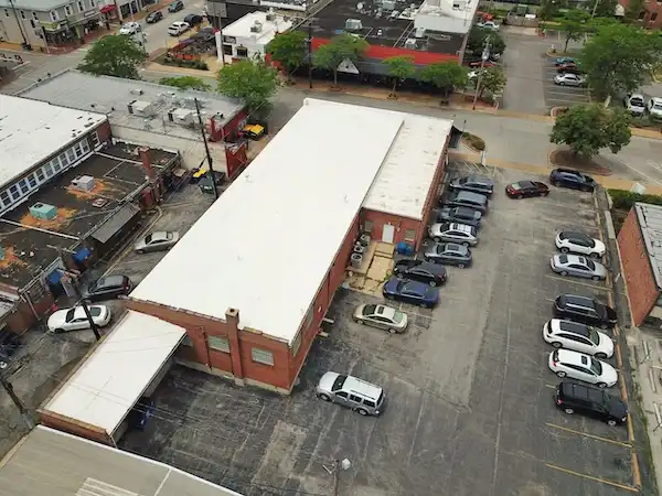 Aerial view of commercial flat roof installation completed by Cardinal Contractors in Kansas City MO