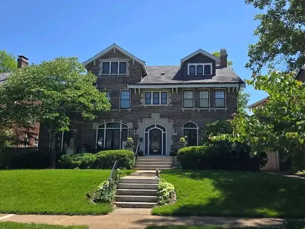 Cardinal Contractors residential siding installation on historic stone home in Lee's Summit MO